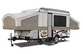 A small camper trailer with a large tent on the back.