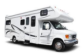 A white rv parked in the street with no people around.