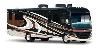 A black and brown motorhome parked in the sun.
