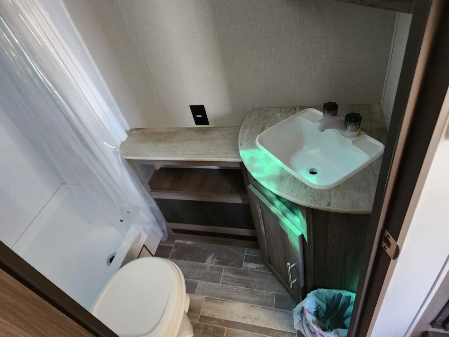 A bathroom with a sink and toilet in it