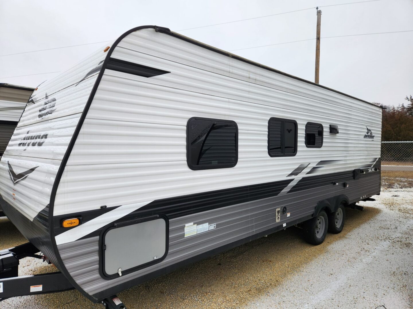 Airstream travel trailer with black and white exterior.